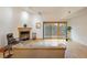 Living room with hardwood floors, fireplace and access to deck at 2938 Kalmia Ave # 6, Boulder, CO 80301