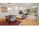 Open-concept living room with a fireplace, high ceilings, a dining area, and large sliding glass doors at 2938 Kalmia Ave # 6, Boulder, CO 80301