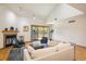 A spacious and inviting living room boasting a fireplace, vaulted ceiling, and access to a private balcony at 2938 Kalmia Ave # 6, Boulder, CO 80301