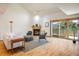 Bright living room featuring a cozy fireplace, vaulted ceiling, and a sliding glass door with mountain views at 2938 Kalmia Ave # 6, Boulder, CO 80301