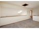Bright loft area featuring neutral carpeting, skylight and unique half wall at 2938 Kalmia Ave # 6, Boulder, CO 80301