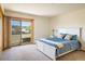 Bedroom with sliding glass door leading to a balcony overlooking the landscape at 2938 Kalmia Ave # 6, Boulder, CO 80301