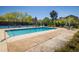 Community pool with lounge chairs and mature trees at 2938 Kalmia Ave # 6, Boulder, CO 80301
