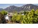 Scenic mountain view from a home surrounded by lush greenery and mature trees in a peaceful setting at 2938 Kalmia Ave # 6, Boulder, CO 80301