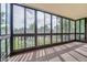 Enclosed sunroom with full window view of outdoor landscaping and light filled interior at 14001 E Marina Dr # 211, Aurora, CO 80014