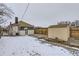 A spacious backyard with a shed, wooden fence, and small porch at 3532 N Vine St, Denver, CO 80205