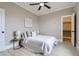 Neutral bedroom with natural light, ceiling fan, and walk-in closet at 3532 N Vine St, Denver, CO 80205