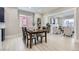 Bright dining room with modern table and chairs, adjacent to a living room with a fireplace at 3532 N Vine St, Denver, CO 80205