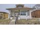 Charming front exterior of a two-story home with a front porch, steps, and a 'for sale' sign at 3532 N Vine St, Denver, CO 80205