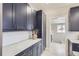 A closer view of the kitchen's cabinetry with ample countertop space at 3532 N Vine St, Denver, CO 80205