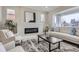 Comfortable living room with a modern fireplace, sofa, and a large window offering natural light at 3532 N Vine St, Denver, CO 80205