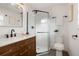 Stylish bathroom with walk-in shower, modern fixtures, and sleek vanity at 4751 S Xenia St, Denver, CO 80237