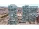 Stunning aerial view of modern glass high-rise buildings in an urban setting, close to downtown with mountain views at 1700 Bassett St # 820, Denver, CO 80202