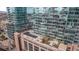 Stunning aerial view of modern high-rise buildings with reflective glass and rooftop lounge at 1700 Bassett St # 820, Denver, CO 80202