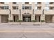 Street view of Glass House entrance with symmetrical design, landscaping, and clear signage at 1700 Bassett St # 820, Denver, CO 80202