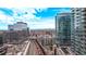 Stunning city views from a modern condo building in a vibrant urban setting with train tracks at 1700 Bassett St # 820, Denver, CO 80202
