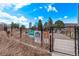 View of the Commons Park Community Garden with plots and informative signage in a pleasant setting at 1700 Bassett St # 820, Denver, CO 80202