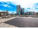 Resort-style community pool with multiple seating areas and city views under a bright sky at 1700 Bassett St # 820, Denver, CO 80202