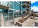 Modern glass condo building featuring sleek balconies, landscaping and gated outdoor spaces at 1700 Bassett St # 820, Denver, CO 80202