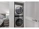 Close-up of a stackable washer and dryer unit in a closet, offering convenience and space-saving design at 1700 Bassett St # 820, Denver, CO 80202