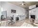 Bright living room featuring a work space with large windows, couch with throw pillows, and hardwood floors at 1700 Bassett St # 820, Denver, CO 80202