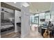 View of cozy living room space flowing into bedroom with modern furnishings and exposed concrete ceilings at 1700 Bassett St # 820, Denver, CO 80202