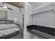 Comfortable main bedroom with modern decor, ceiling fan, and a vanity area, providing a relaxing retreat at 1700 Bassett St # 820, Denver, CO 80202