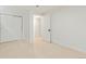 Basement bedroom featuring neutral carpet, white walls and doors, and access to other rooms at 6087 S Elizabeth Way, Centennial, CO 80121