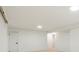 Bright basement with recessed lighting, neutral carpet, and white walls at 6087 S Elizabeth Way, Centennial, CO 80121