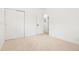 Carpeted bedroom featuring a closet, white walls and doors, and a view into the hallway at 6087 S Elizabeth Way, Centennial, CO 80121