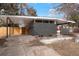 Contemporary exterior elevation with carport, painted brick, and level front yard at 6087 S Elizabeth Way, Centennial, CO 80121