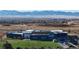 Aerial view of school, playground, and mountain backdrop at 8625 Clay St # 227, Westminster, CO 80031