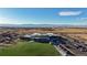 Aerial view of school, playground, and mountain backdrop at 8625 Clay St # 227, Westminster, CO 80031