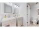 Double sink bathroom with toilet and mirrors at 8625 Clay St # 227, Westminster, CO 80031