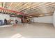 Large unfinished basement with exposed wood beams and concrete flooring offers great potential at 27234 E Quarto Ave, Aurora, CO 80016