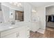 Elegant bathroom with double vanities, granite countertops, modern fixtures, and a glass-enclosed shower at 27234 E Quarto Ave, Aurora, CO 80016