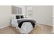 Comfortable bedroom features a queen bed, carpeted floors, and natural light from the window at 27234 E Quarto Ave, Aurora, CO 80016