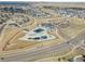 Aerial view of a community pool and clubhouse with ample parking and well-maintained landscaping at 27234 E Quarto Ave, Aurora, CO 80016
