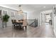Dining room with modern light fixture, wood table, and seating for four at 27234 E Quarto Ave, Aurora, CO 80016