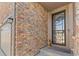Charming entryway highlighting the stone facade and decorative security door at 27234 E Quarto Ave, Aurora, CO 80016