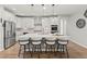 Open concept kitchen with island, stainless appliances, pendant lighting, and seating for four at 27234 E Quarto Ave, Aurora, CO 80016