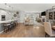 Bright and airy living space featuring a fireplace, large windows, and an open concept kitchen with bar stool seating at 27234 E Quarto Ave, Aurora, CO 80016