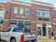 Retail shops and businesses in a commercial shopping center, with ample parking and pedestrian walkways at 27234 E Quarto Ave, Aurora, CO 80016