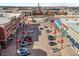 An aerial perspective capturing a bustling shopping center with diverse retail outlets and ample parking at 27234 E Quarto Ave, Aurora, CO 80016