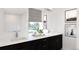 Bathroom featuring a double sink vanity, framed mirrors, and modern fixtures at 3877 Bahn Ct, Evergreen, CO 80439