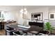 Open concept dining room featuring dark wood dining table, modern lighting, and stylish decor at 3877 Bahn Ct, Evergreen, CO 80439