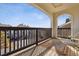 Cozy balcony with wooden floors and railing, offering a serene view of the surrounding neighborhood at 18989 E Warren Dr # G303, Aurora, CO 80013