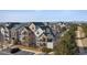 Exterior view of multiple condo buildings in a well-maintained community with mountain views at 18989 E Warren Dr # G303, Aurora, CO 80013