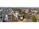 Exterior view showcasing the building design, landscaping, and surrounding neighborhood at 18989 E Warren Dr # G303, Aurora, CO 80013