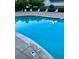 Inviting community pool with several lounge chairs for residents' relaxation and enjoyment at 18989 E Warren Dr # G303, Aurora, CO 80013